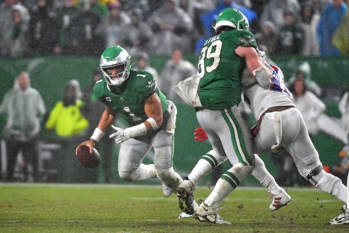 Philadelphia Eagles quarterback Jalen Hurts (1) scrambles away from pressure against the Buffalo Bills during overtime at Lincoln Financial Field.